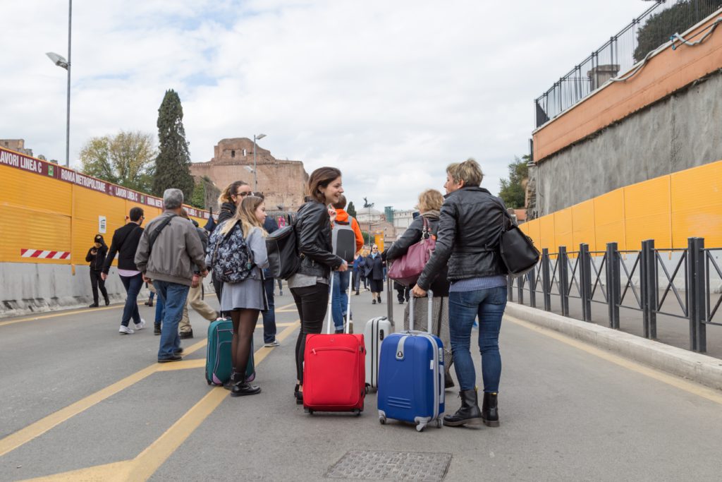 Group with noisy suitcases