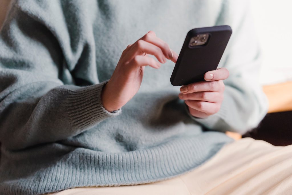 A photo of someone using their phone to show fast message responses