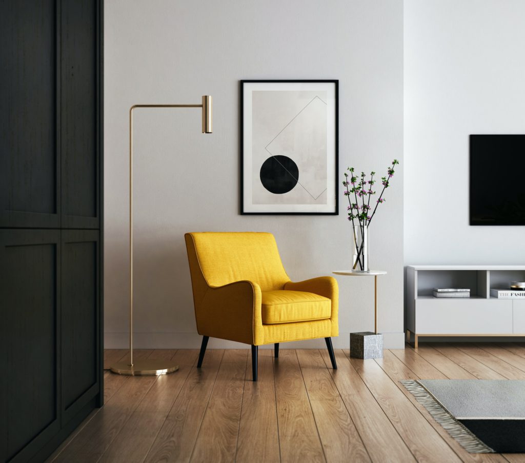 Photo of a vacation rental property with a yellow chair and gray wall.